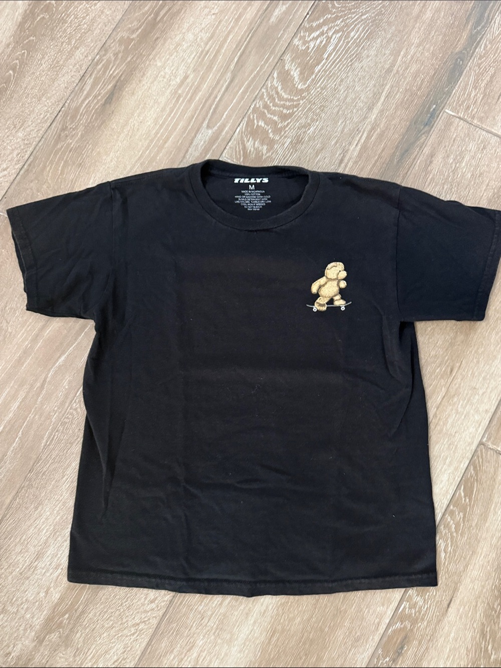 Tillys boys Black Tee with Skateboarding Teddy logo. Size medium